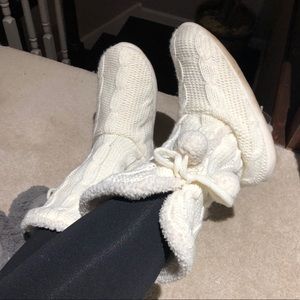 Cream sweater socks with suede bottom and pom poms